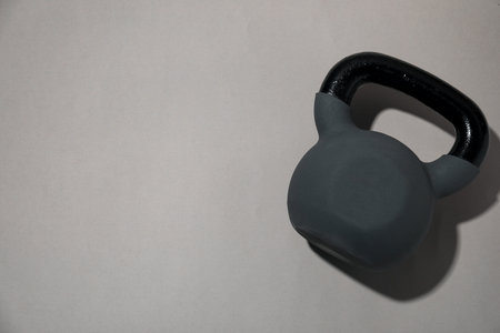 One kettlebell on light gray background, top view. Space for textの写真素材