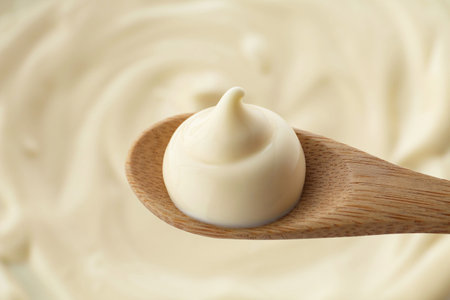Spoon with delicious mayonnaise sauce, closeup viewの写真素材