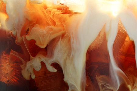 Refreshing coffee with ice and milk as background, closeupの写真素材