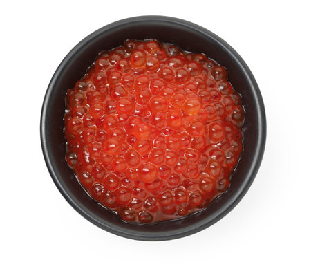 Delicious red caviar in bowl isolated on white, top viewの写真素材