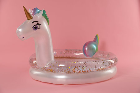 Inflatable unicorn shaped ring on pink backgroundの写真素材