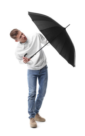 Man with black umbrella on white backgroundの写真素材