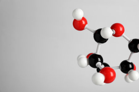Molecule of glucose on light grey background, closeup and space for text. Chemical modelの写真素材