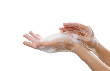 Woman washing hands with foaming soap on white background, closeup. Hygieneの写真素材