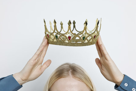Woman wearing elegant crown on light background, closeupの写真素材