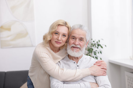 Senior man and mature woman at home. Happy couple