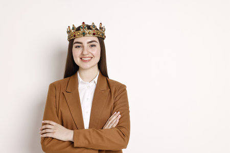 Happy businesswoman in elegant crown on light background. Space for textの写真素材