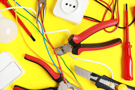 Different electrical tools on yellow background, flat layの写真素材