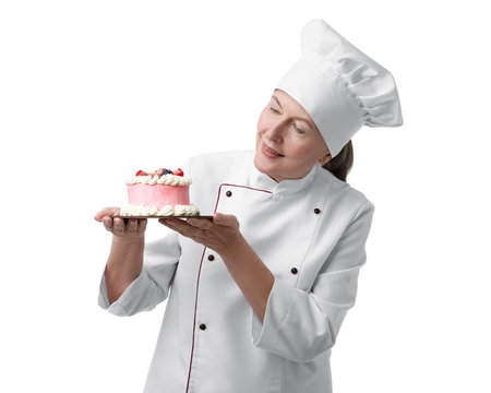 Professional pastry chef with cake on white backgroundの写真素材