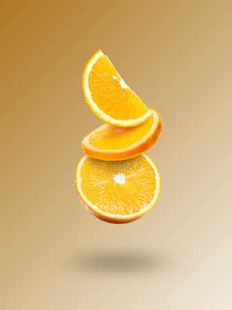 Fresh orange pieces falling on color gradient background
