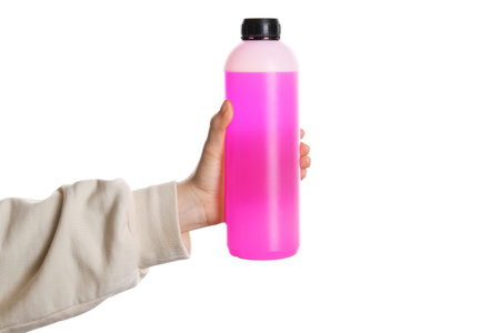 Woman with plastic bottle of antifreeze on white background, closeup