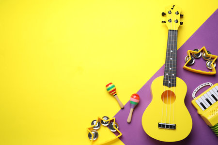 Flat lay composition with different toy musical instruments on color background. Space for textの写真素材