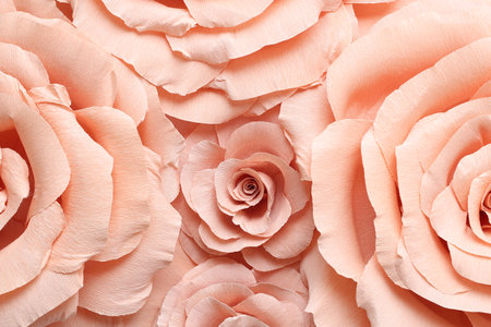 Beautiful pink paper flowers as background, top viewの写真素材