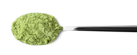 Superfood product. Pumpkin seeds powder in spoon isolated on white, top viewの写真素材