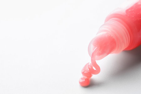 Tube of lip balm on white background, closeup. Space for textの写真素材