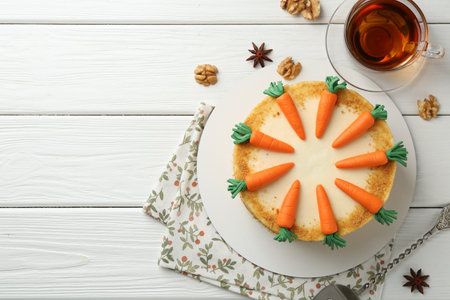 Delicious homemade carrot cake served on white wooden table, flat lay. Space for textの写真素材