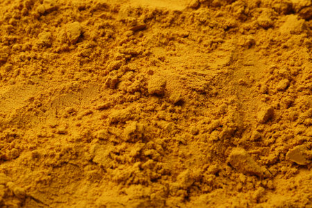 Superfood supplement. Turmeric powder as background, closeupの写真素材