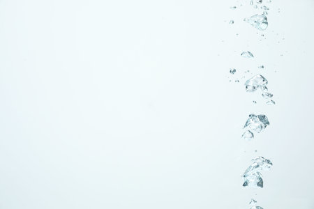 Many water bubbles on light background, closeup. Space for text