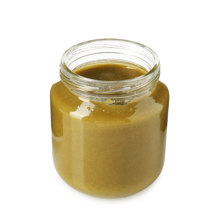 Baby food. Tasty puree in glass jar isolated on whiteの写真素材