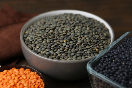 Different types of lentils on wooden table, closeupの写真素材