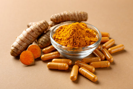Turmeric capsules, powder and roots on beige background, closeupの写真素材