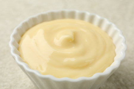 Tasty vanilla pudding on light textured table, closeupの写真素材