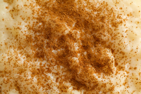 Delicious rice pudding with cinnamon as background, closeupの写真素材