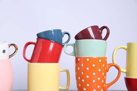 Many colorful cups on white background, closeupの写真素材