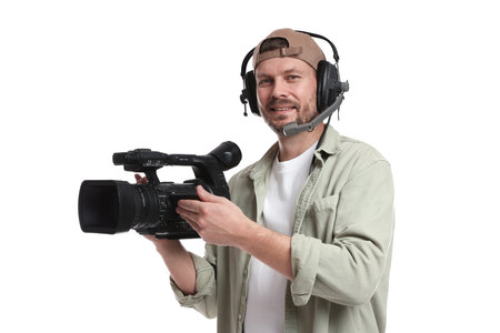 Man with professional video camera and headset on white background