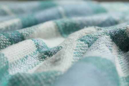 Turquoise woolen fabric as background, closeup view