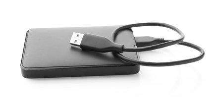 External hard drive with USB cable isolated on white