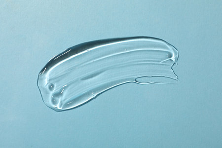 Cosmetic product on light blue background, top viewの写真素材