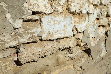 Stone building wall with cracks after strong earthquakeの写真素材