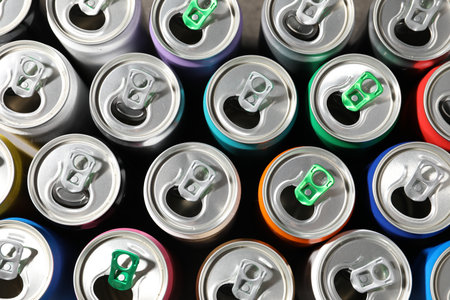Many aluminium cans of beverage as background, top viewの写真素材