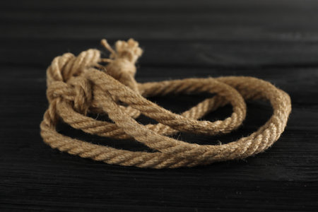 Cotton rope on black wooden background, closeupの写真素材