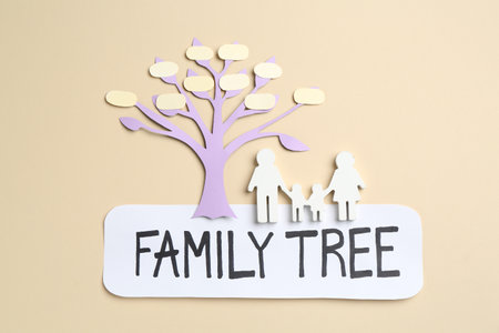 Family tree and people figure on beige background, top viewの写真素材