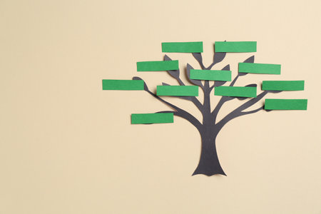 Family tree on beige background, top view. Space for textの写真素材