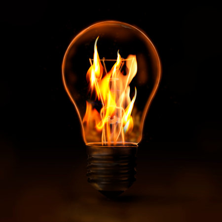 Idea concept. Light bulb with flames inside on black backgroundの写真素材