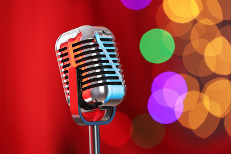 One vintage microphone against red curtain, space for text. Bokeh effectの写真素材