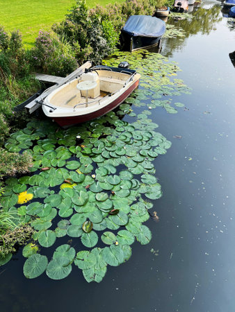 Beautiful view of canal with moored boatsの写真素材