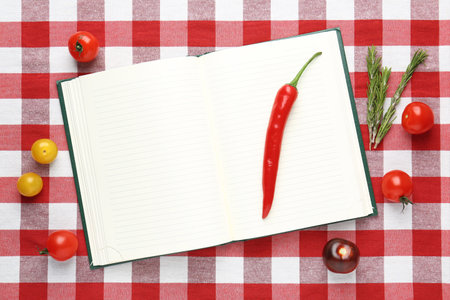 Blank recipe book and products on checkered tablecloth, top view. Mockup for designの写真素材