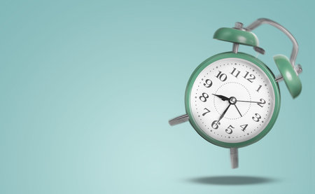 Green alarm clock ringing and jumping on light blue background. Banner design with space for text