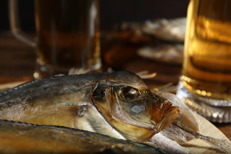 Dried fish and beer on table, closeupの写真素材