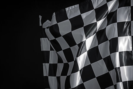 One racing checkered flag on black background, space for textの写真素材