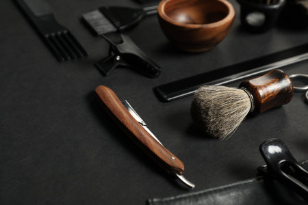 Many different barber's tools on black table, closeupの写真素材