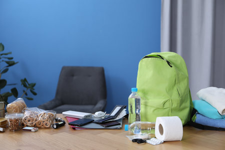 Survival kit. Different emergency supplies on wooden table indoorsの写真素材