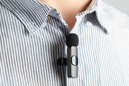 Man with lavalier microphone attached to his shirt, closeupの写真素材
