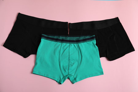 Comfortable men's underwear on pink background, flat layの写真素材