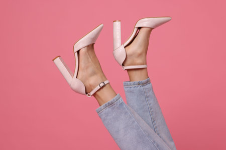 Woman wearing stylish shoes on pink background, closeupの写真素材