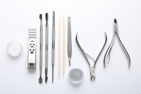 Set of different manicure tools on white background, flat layの写真素材